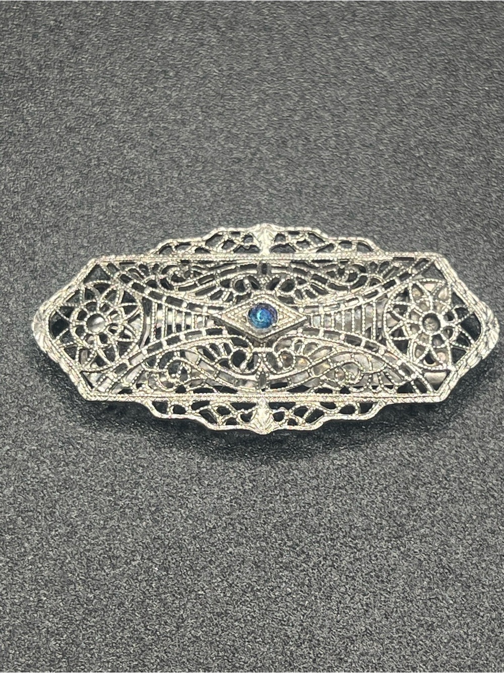 Vintage 1930s Art Deco Nickel Silver Filigree Dress Clip with blue rhinestone